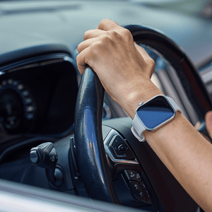 Hands-on-wheel-driving-rental-car